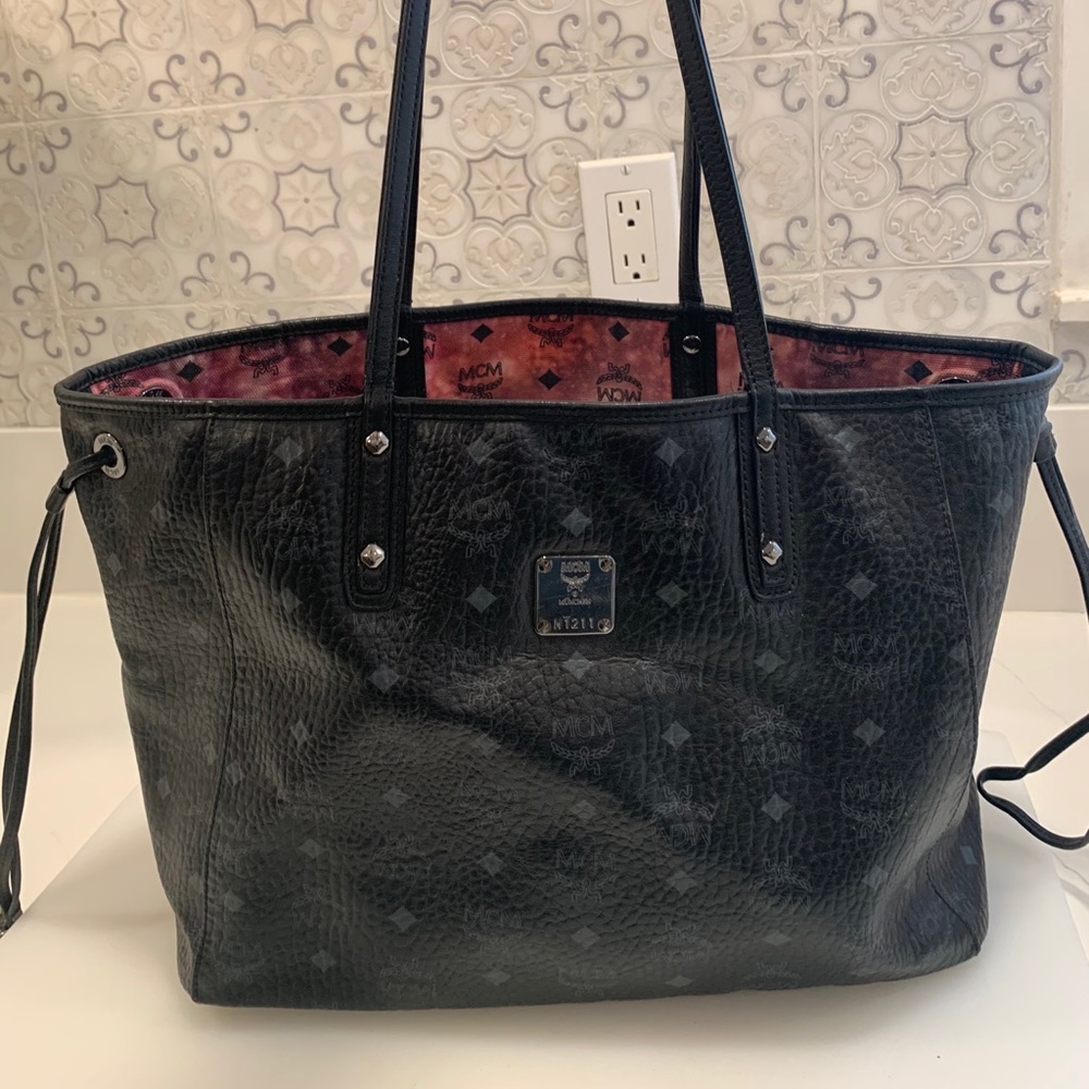 Used reversible MCM black galaxy tote